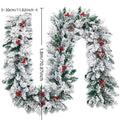 Snow-flocked artificial rattan Christmas garland in green and white on a wooden mantelpiece.