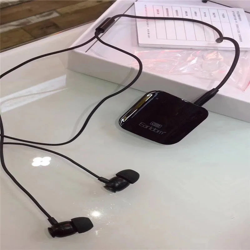 Bluetooth lavalier headset clipped to clothing showing wireless design