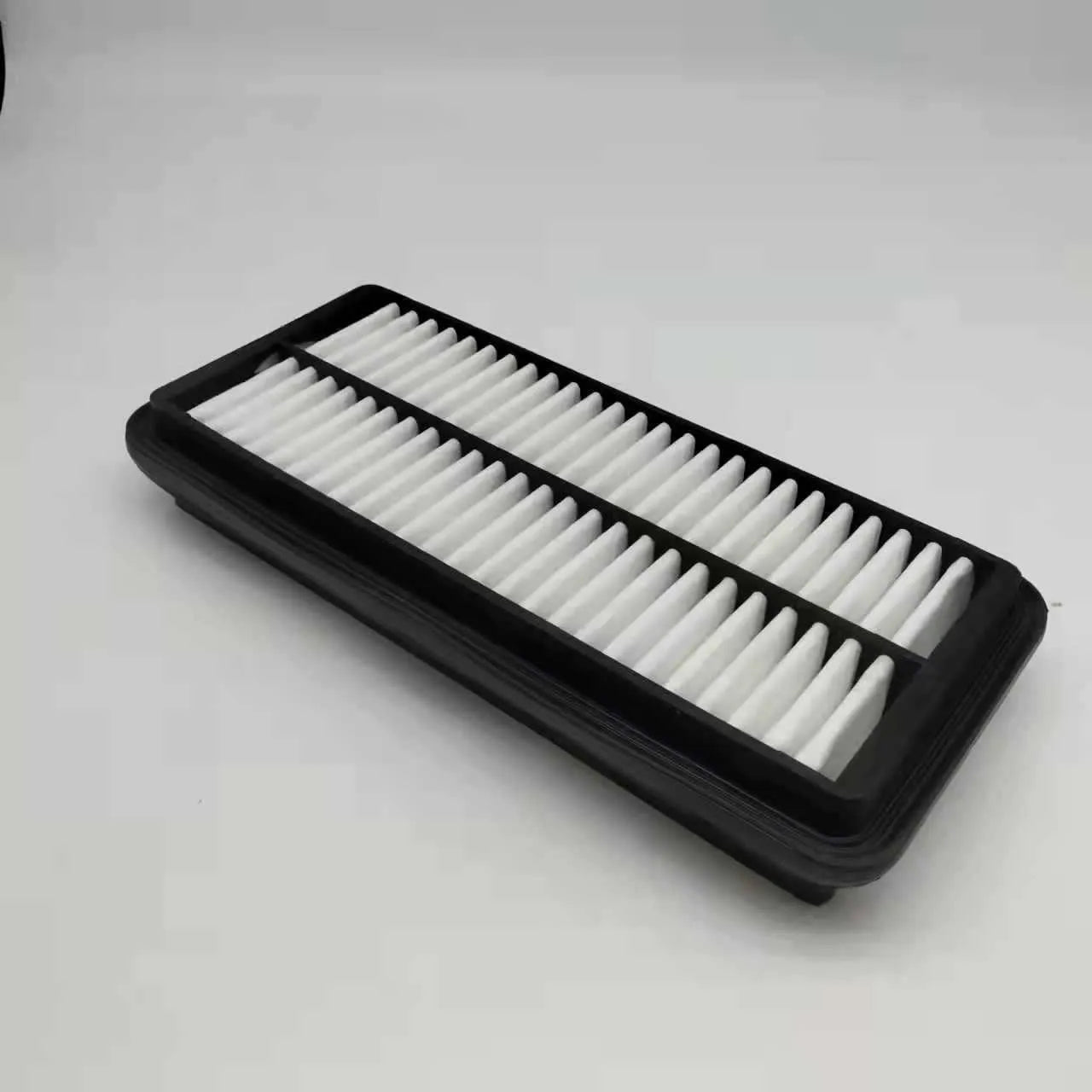 Modern car air filter replacement with dimensions 256mm by 113mm by 40mm, black filter element