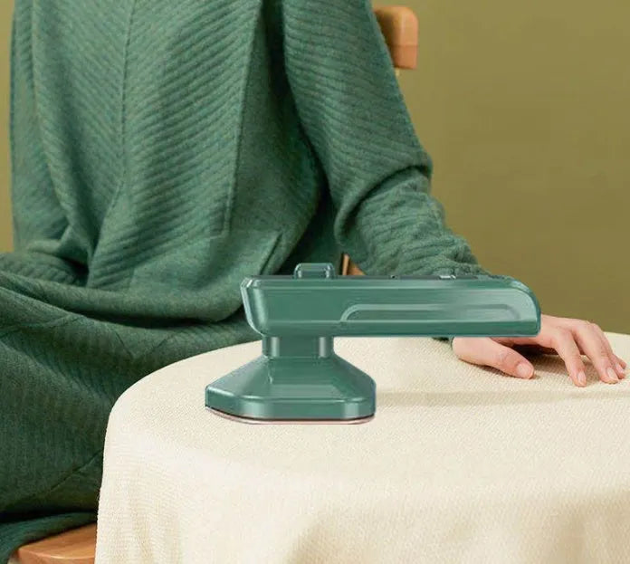 Dark green portable hanging ironing machine with ceramic panel and handheld design
