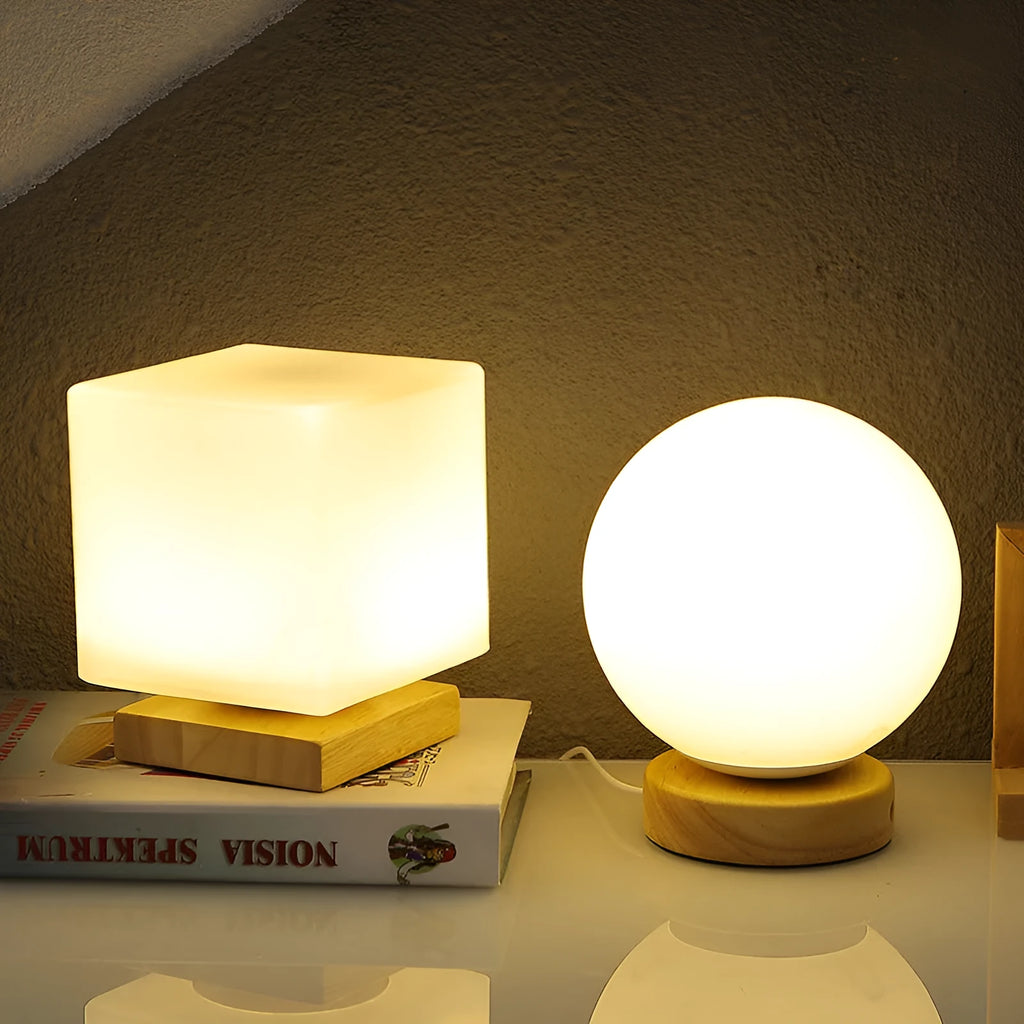 Nordic solid wood USB table lamp in a geometric shape on a wooden surface.