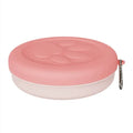 Portable plastic dog bowl set with main dish and attached snack box in green two-tone colour.