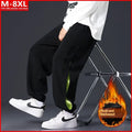 Men's loose cotton trousers with stitching printing design and ankle banded cuffs in black colour