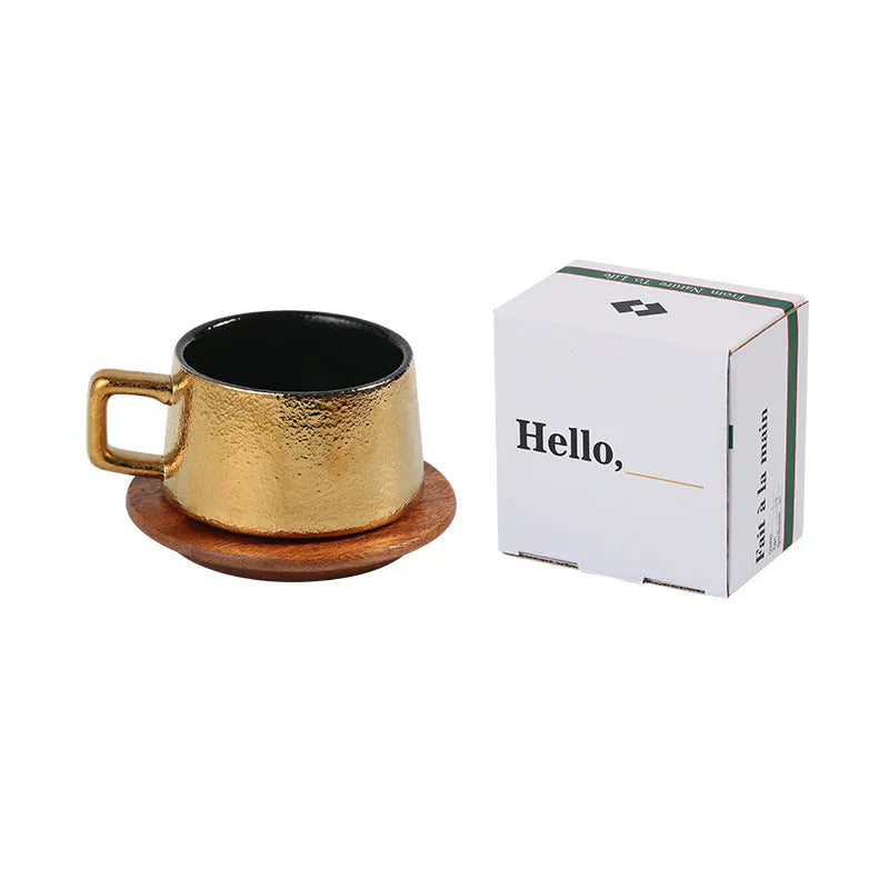 Gold and silver plated gift box next to a 250ml solid colour coffee travel mug.