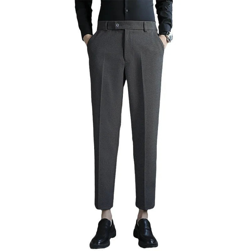 Brown straight leg corduroy trousers with elastic waistband on hanger