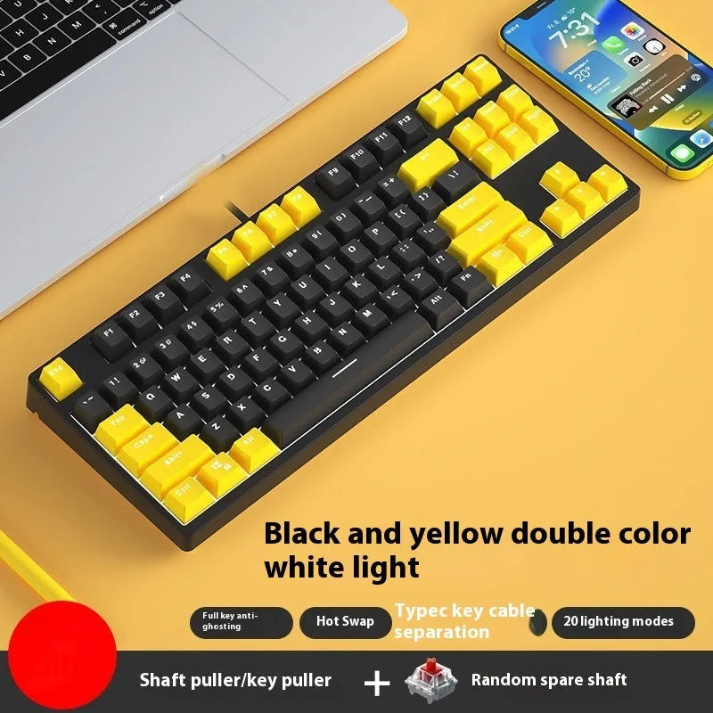 87 key wired mechanical keyboard with metal chassis shown in a black, orange, and yellow colour configuration.