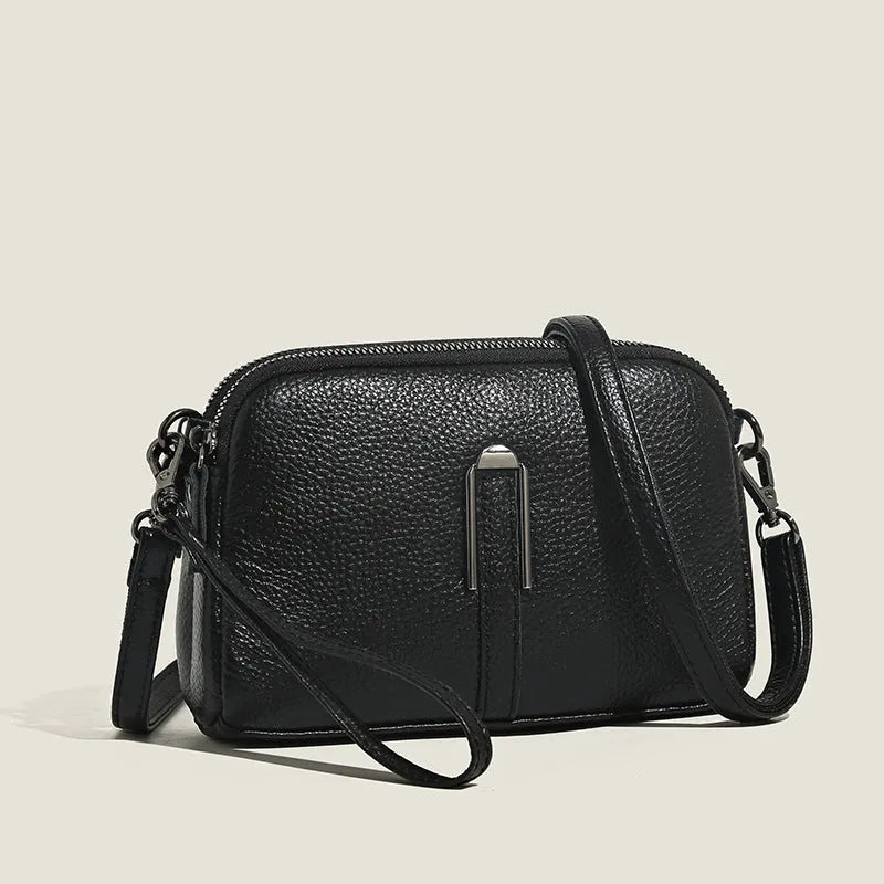 Square genuine leather ladies shoulder bag in dark khaki colour showing structured silhouette.