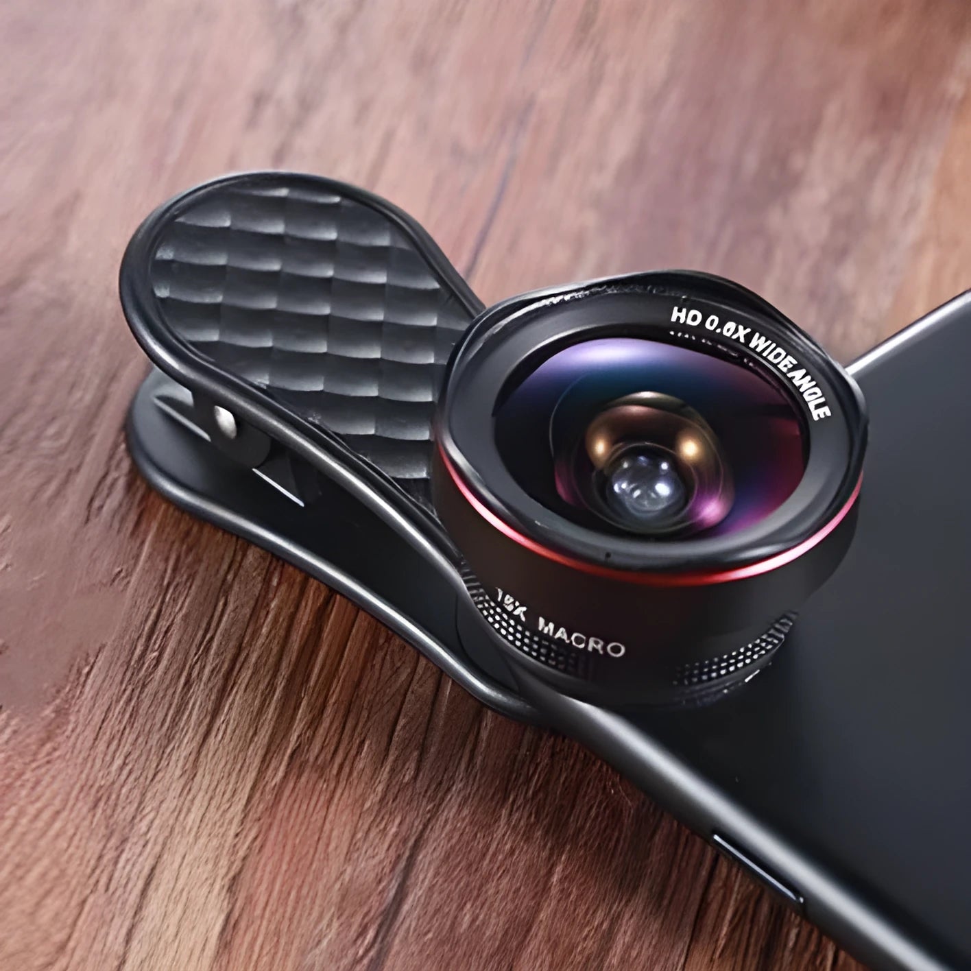 Black mobile phone lens kit with wide-angle and macro lenses, clip, and storage box
