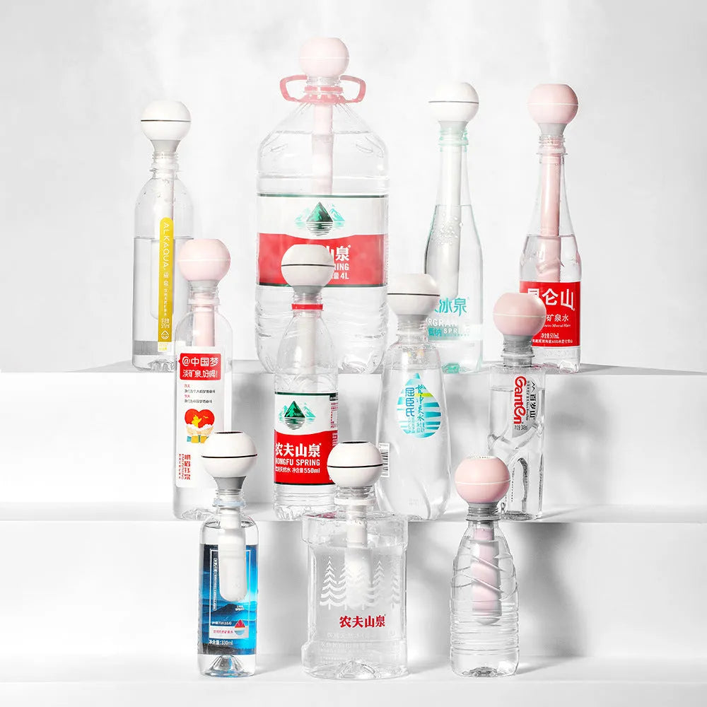 Pink and white columnar ultrasonic humidifier with USB cable and water tank