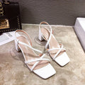 Women's white thick heel wedge sandals with over 8cm high platform and open back design.