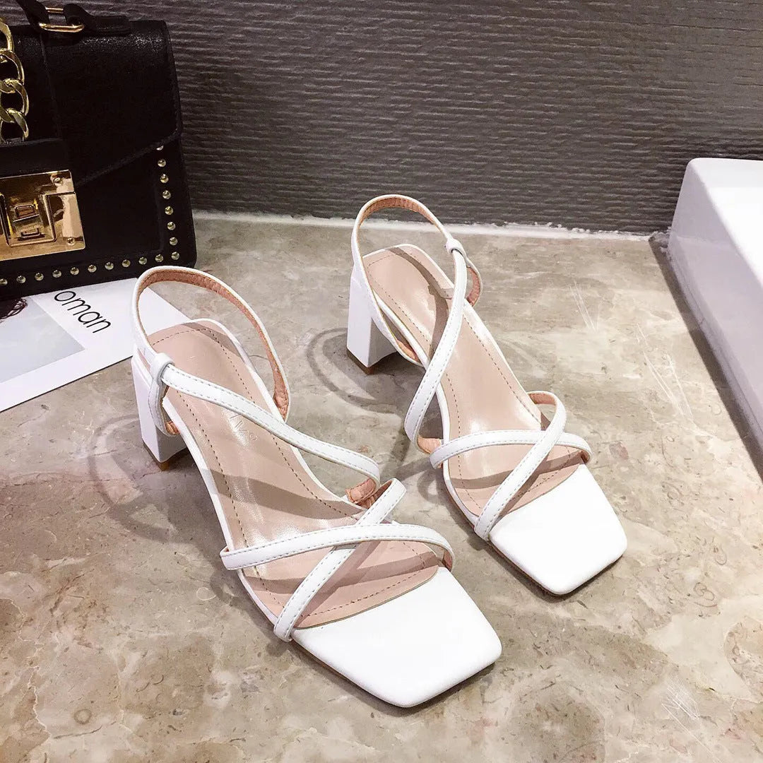 Women's white thick heel wedge sandals with over 8cm high platform and open back design.