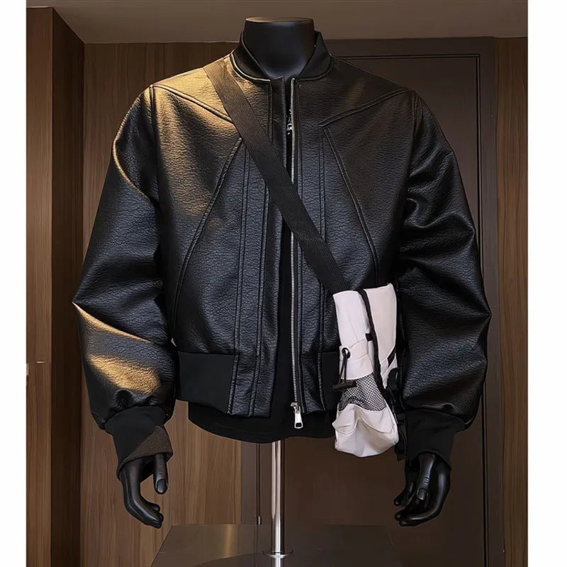 Men's black PU leather jacket with litchi grain texture, showing extended length and tight fit.