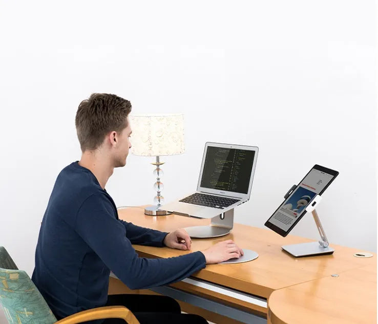 Foldable aluminium desktop phone and tablet holder showing 360° rotation capability