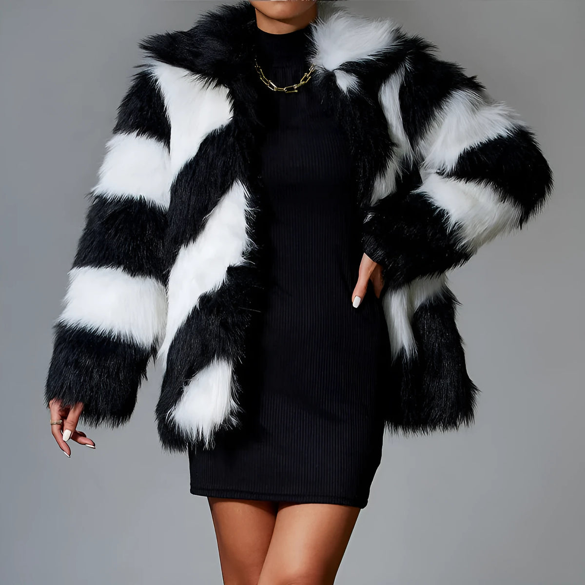 Women's faux fur coat with contrasting colour lapels and a fur collar.