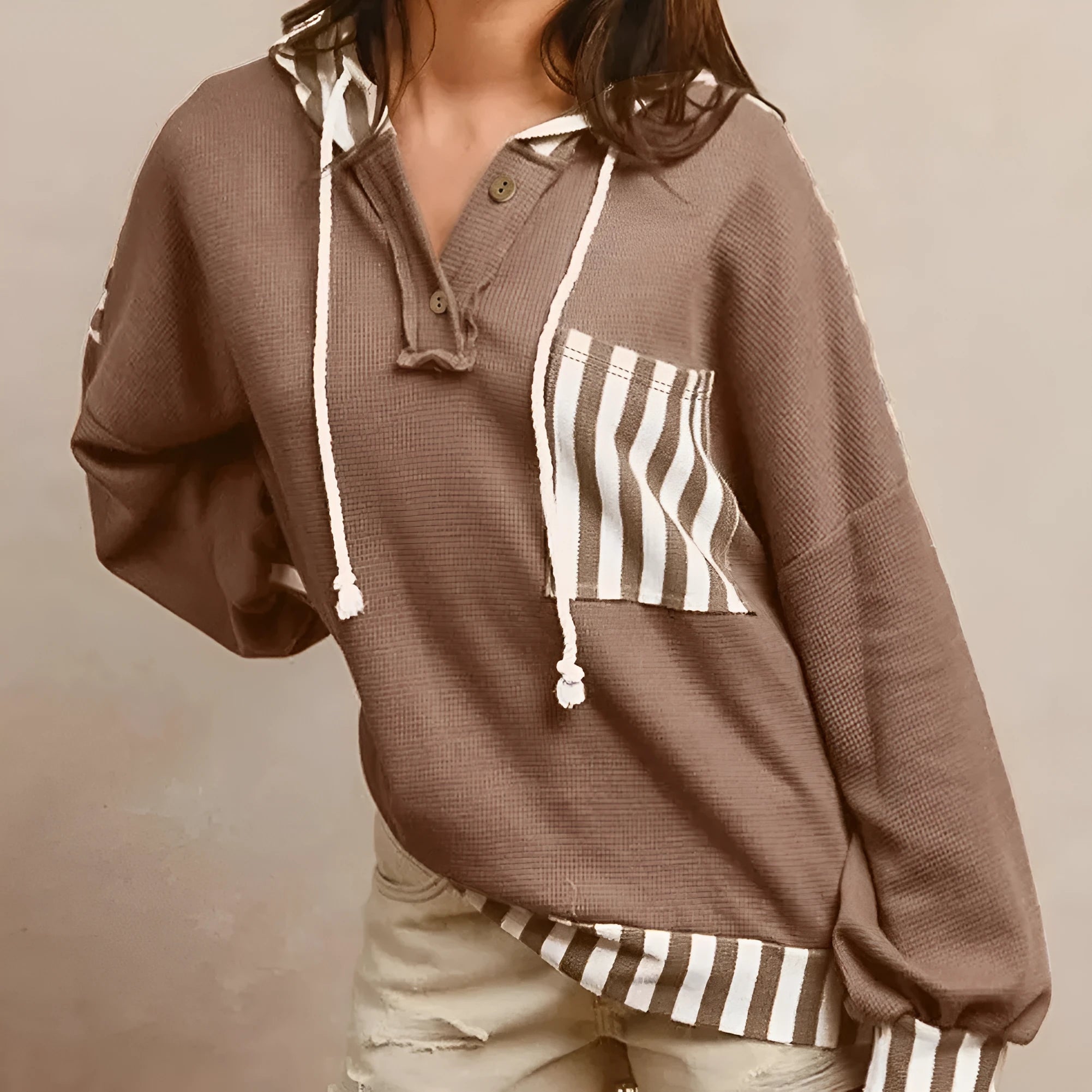 Straw yellow women's hoodie with waffle texture, striped patchwork, button neck, and drawstring waist.