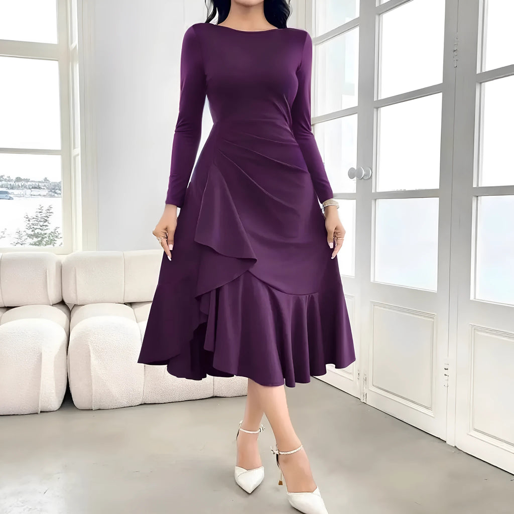 Purple women's long sleeve dress with round neck and ruffle details on a hanger.