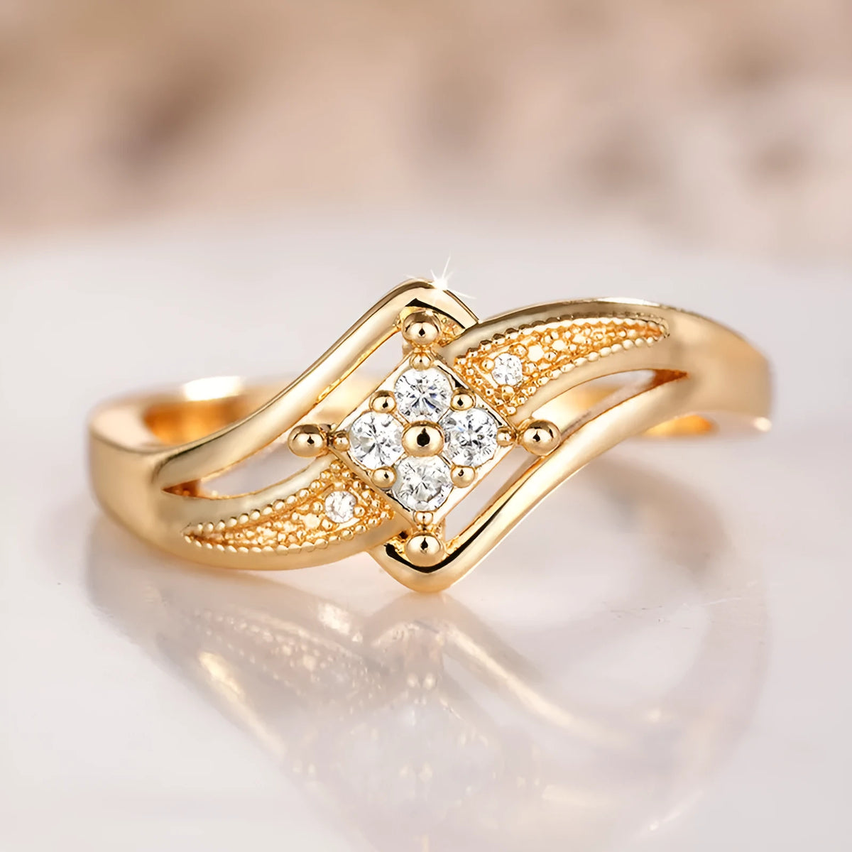 Yellow gold coloured copper diamond ring with geometric design and micro inlaid zircon detailing