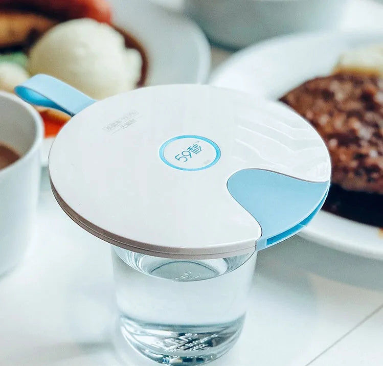 Slim blue portable UV-C baby bottle steriliser showing USB port and dimensions