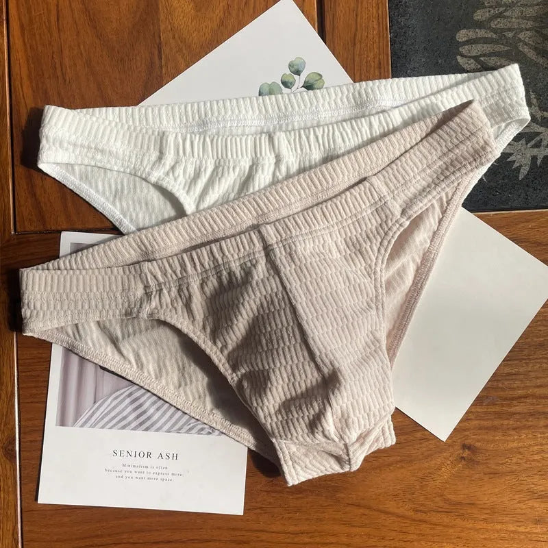 Men's solid colour pure cotton triangle briefs with a mid-waist waistband.