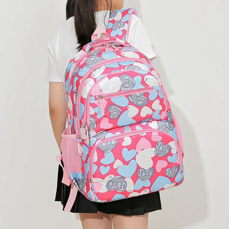 Blue children's schoolbag with air pillow shoulder straps and Oxford cloth exterior.