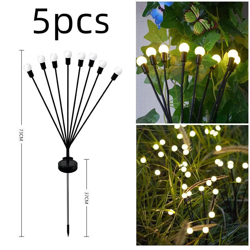 Solar-powered LED garden spike light with stainless steel ground plug stuck in soil.