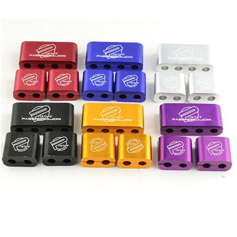 Three-piece metal car modification fastening clamp in assorted colours on a white background