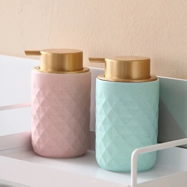 ABS plastic foam pump for facial cleanser in metallic gold finish with large foaming dispenser head.