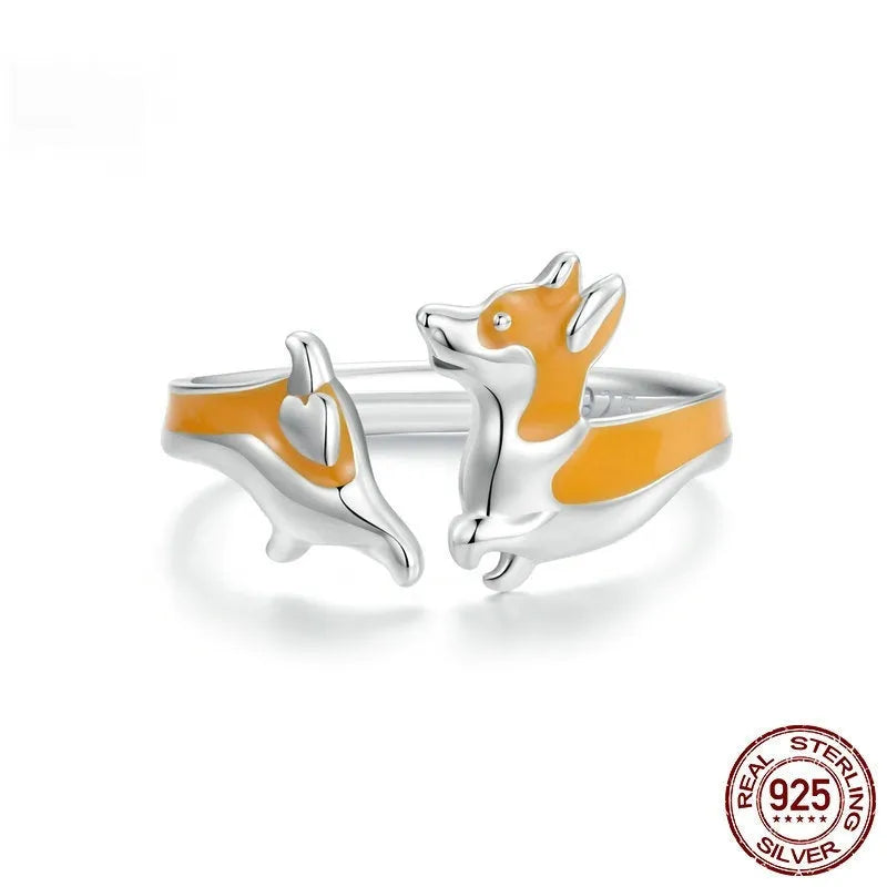 Silver ring with a raised cartoon corgi design in colour SCR1014-E.