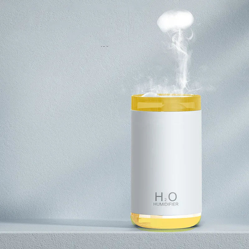 White USB jellyfish humidifier with warm night light on a table