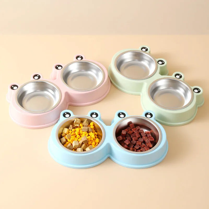 Stainless steel double pet bowl with frog-shaped non-slip base in blue, green, and pink colours