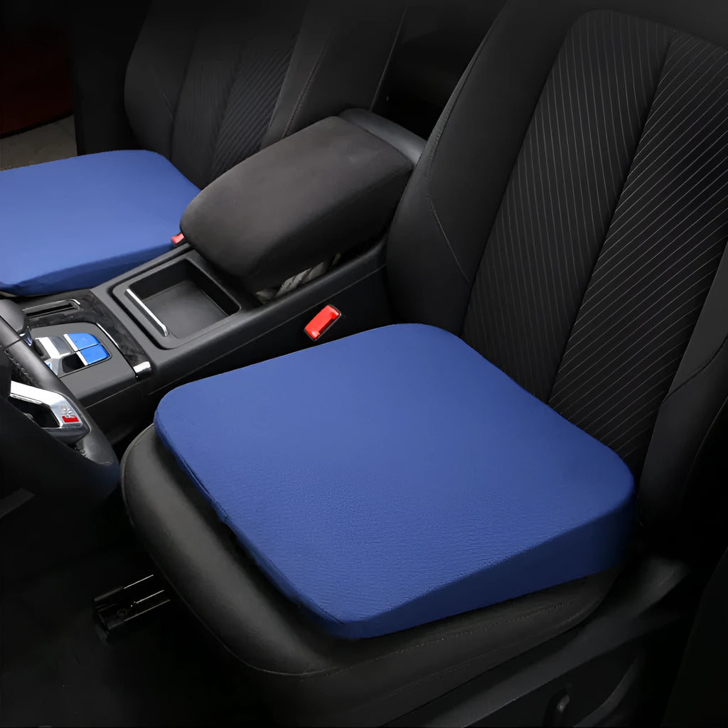 Black car seat cushion adding 6cm of height on a vehicle seat.
