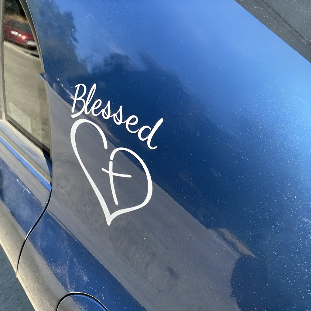 Large red heart-shaped sticker with the words Faith, Hope, Love printed on it.