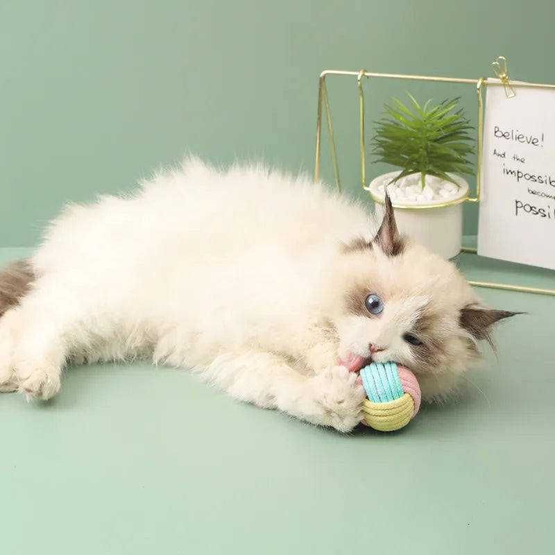 Handmade plush cotton cat hair ball toy in blue powder, green blue, or pink green colours for teeth grinding and boredom relief
