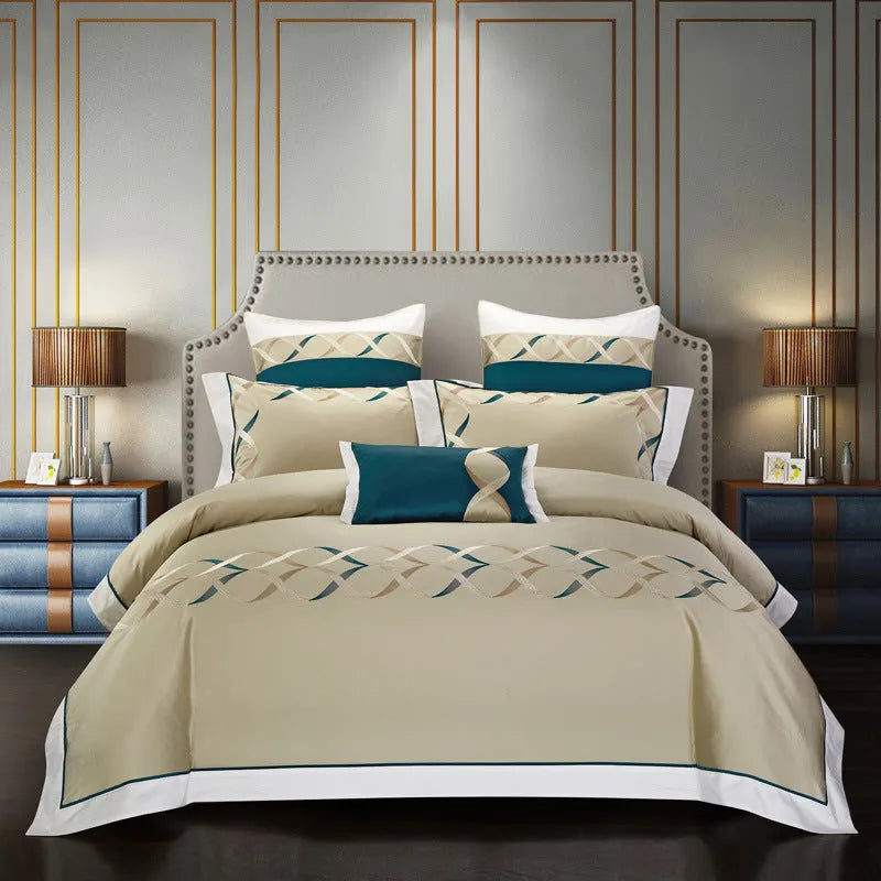 Four-piece cotton embroidery bedding set in a satin weave, shown in one of five printed designs.
