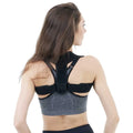 Black adjustable posture correction strap for back support.