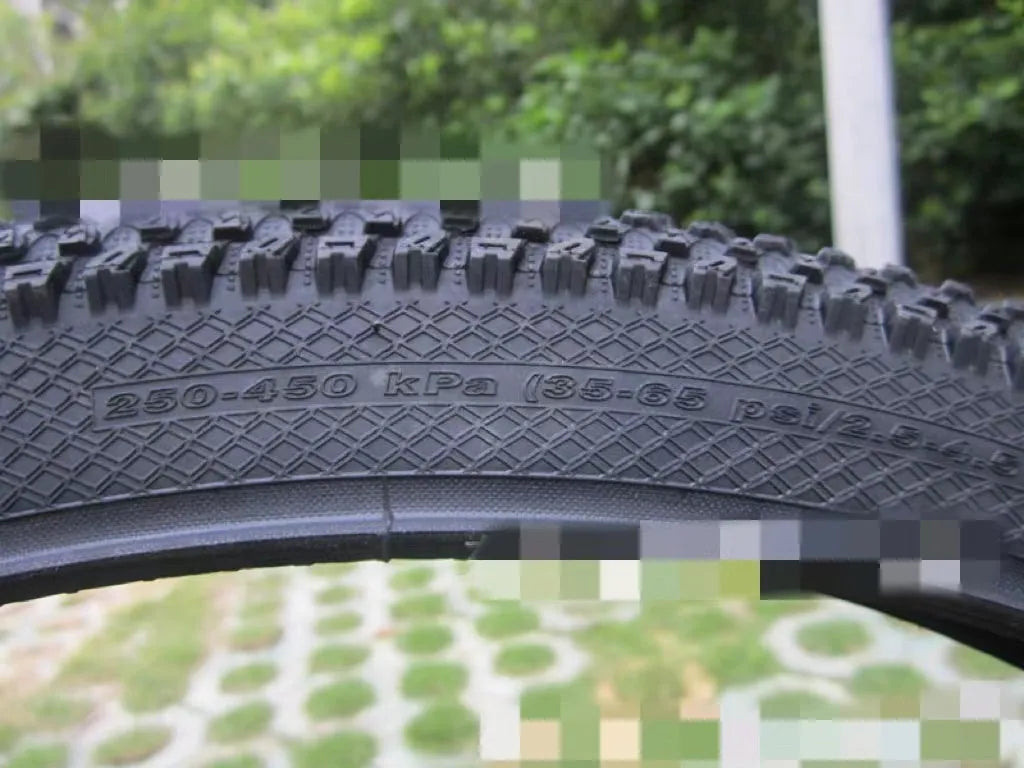 Ultralight mountain bike tyre with reinforced sidewall, shown in a 29x2.1 size with white label.