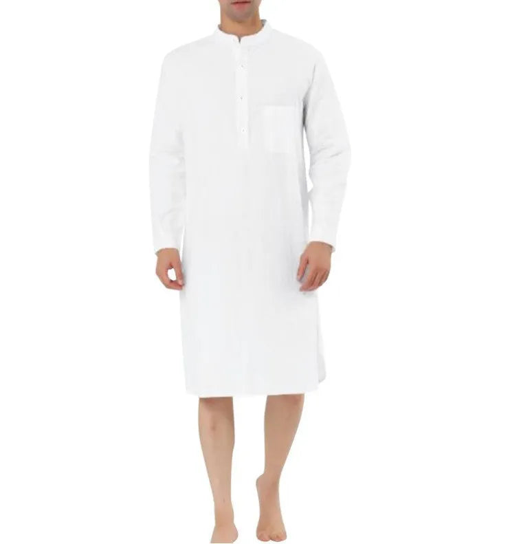Man wearing a dark blue cotton shirt robe with button front and chest pockets.