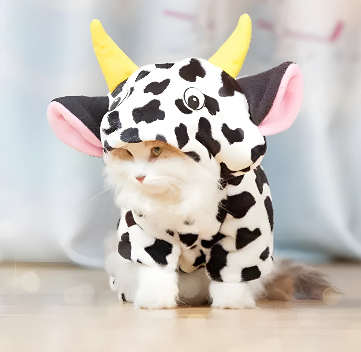 White cow costume hooded pet coat for dogs and cats, sizes XS to XL, with length and bust measurements