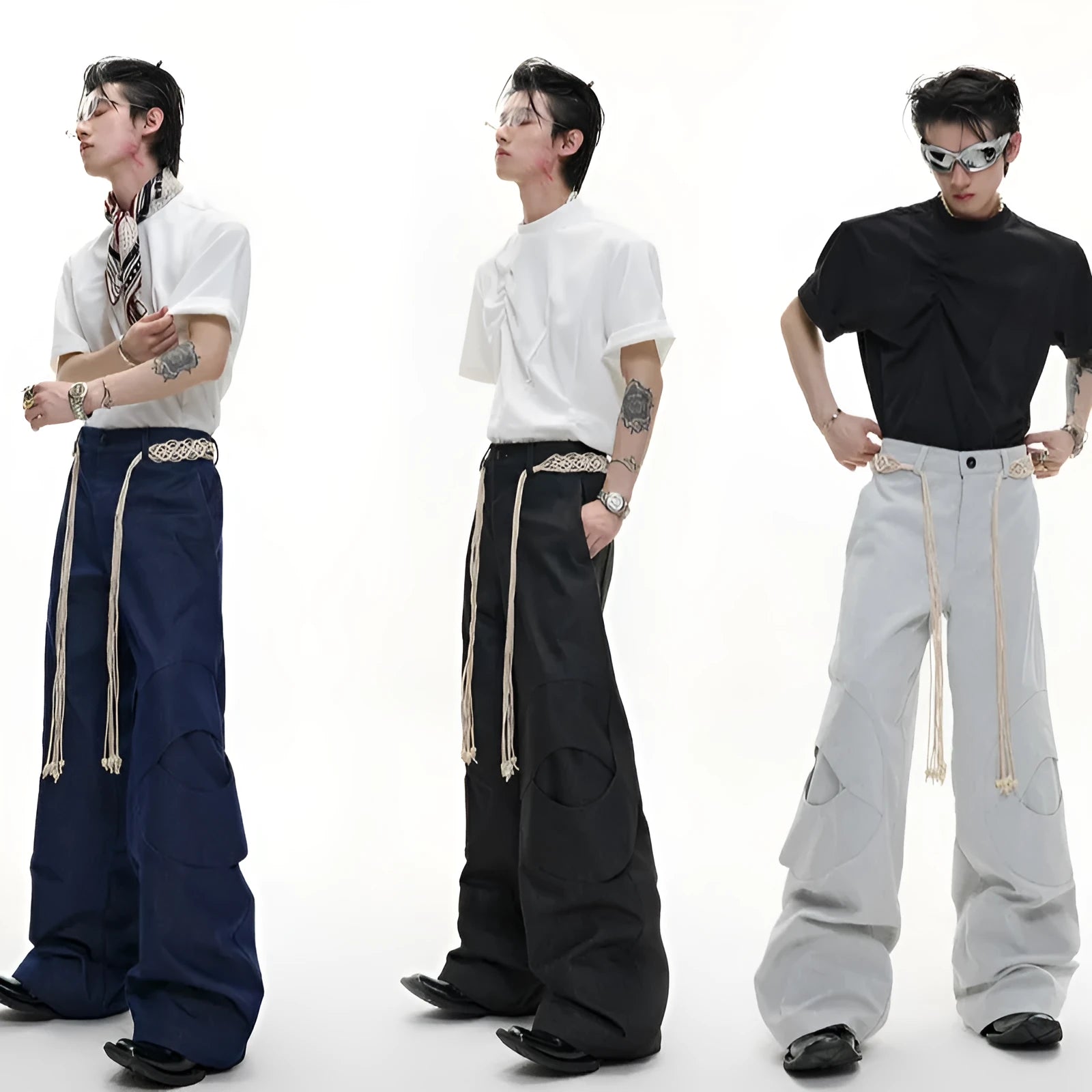 Men's dark blue loose fit straight-leg jeans with decorative belt stitching and zipper details.