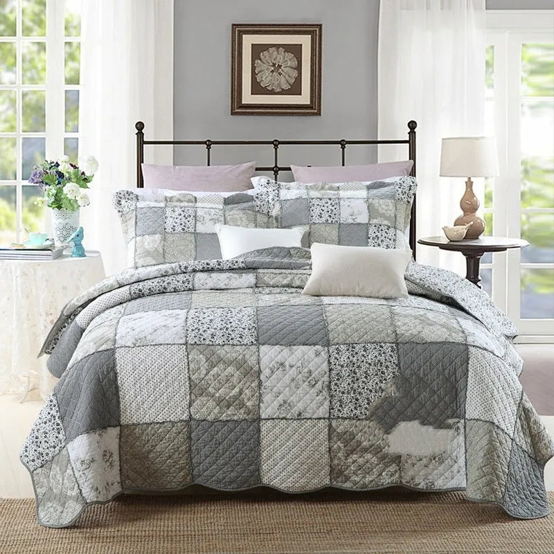 Pure cotton quilted bedspread and pillowcase three-piece set in a chosen colour pattern on a bed.
