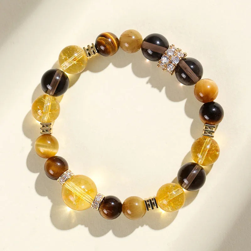 Natural yellow crystal bead bracelet with 10mm Jinba beads on wrist