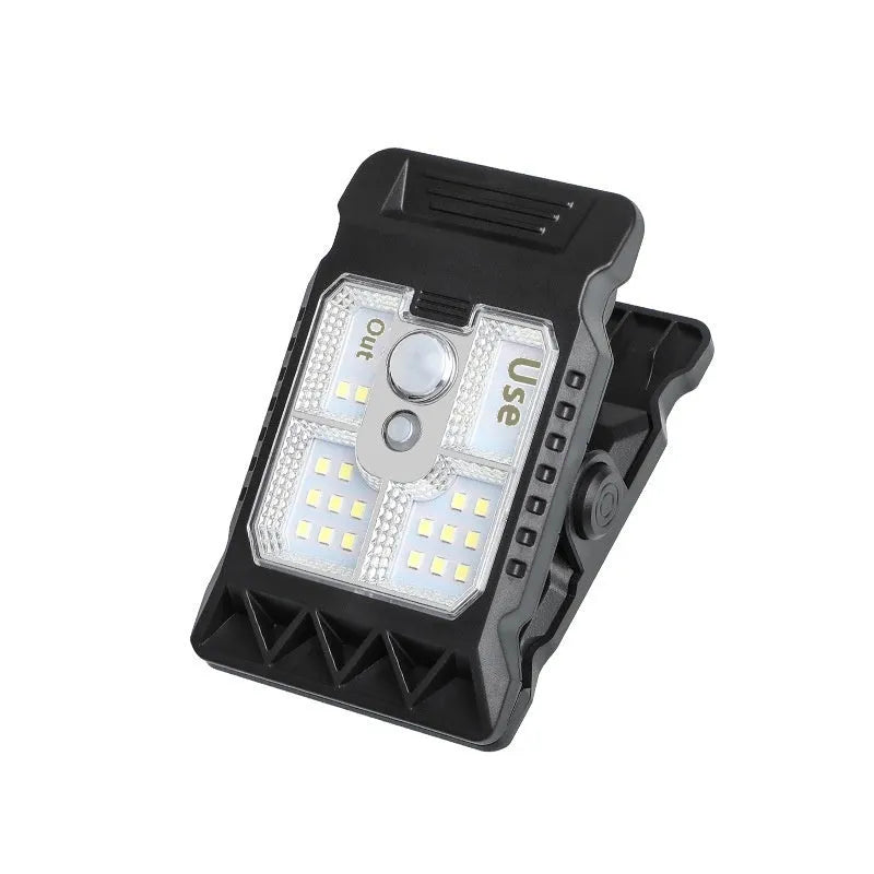 Compact motion-sensing clip lamp with white ABS housing mounted on shelf edge