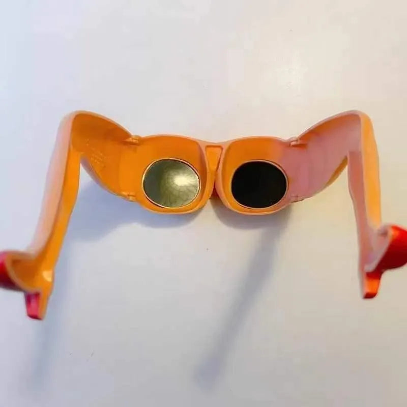 Orange plastic personality sunglasses for novelty leg and hip wear.