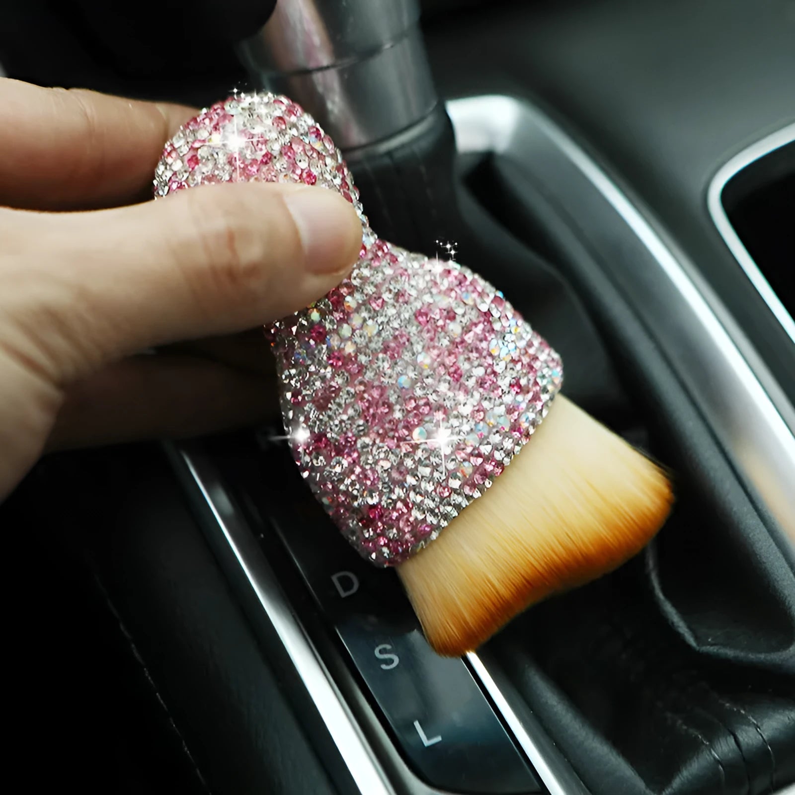 Soft PVC car interior cleaning brush for dust removal on dashboard and seats.