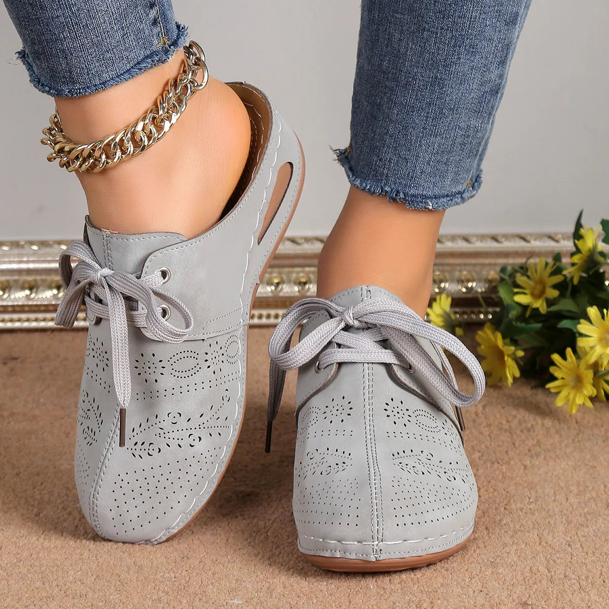 Women's summer baotou lace-up slippers with hollow-out wedge sole in a light grey colour.