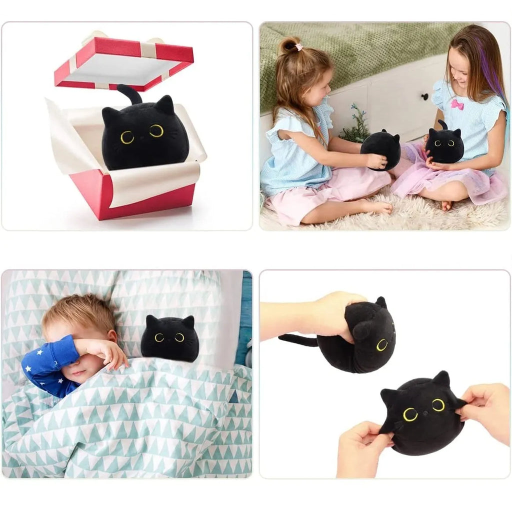 Fluffy black cat stuffed toy with embroidered eyes and whiskers on a grey background.