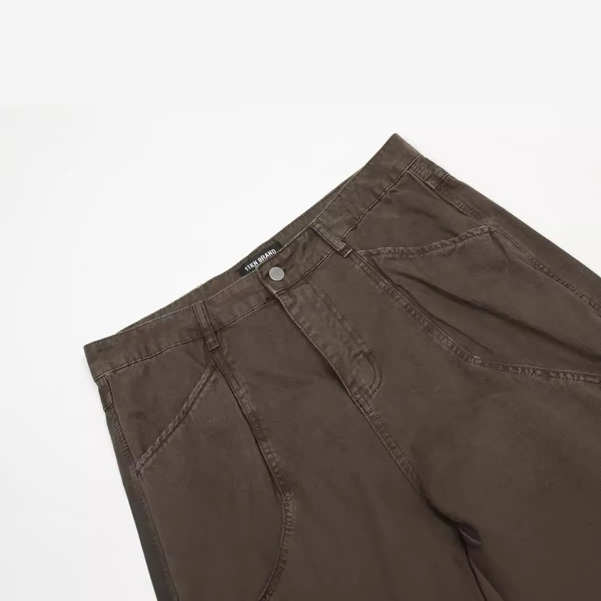 Men's brown straight leg cotton jeans with high waist and zipper fly closure