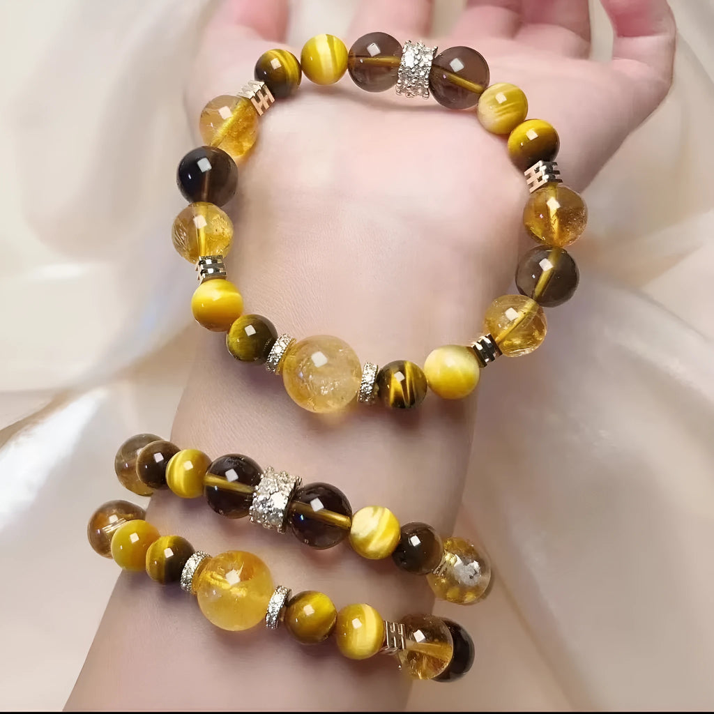 Natural yellow crystal bead bracelet with 10mm Jinba beads on wrist