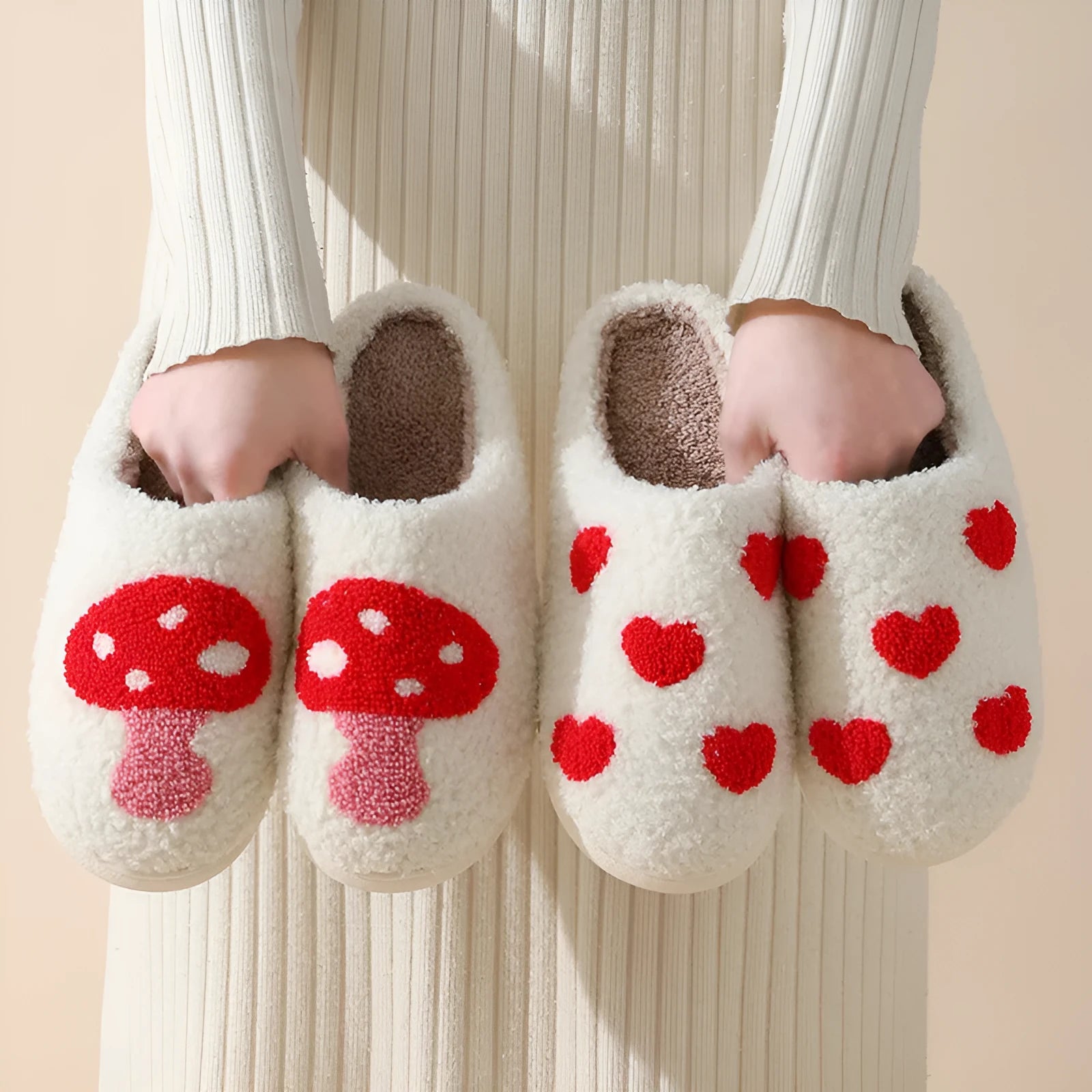 Women's plush home slippers in cartoon love style print with round toe and non-slip PVC sole.