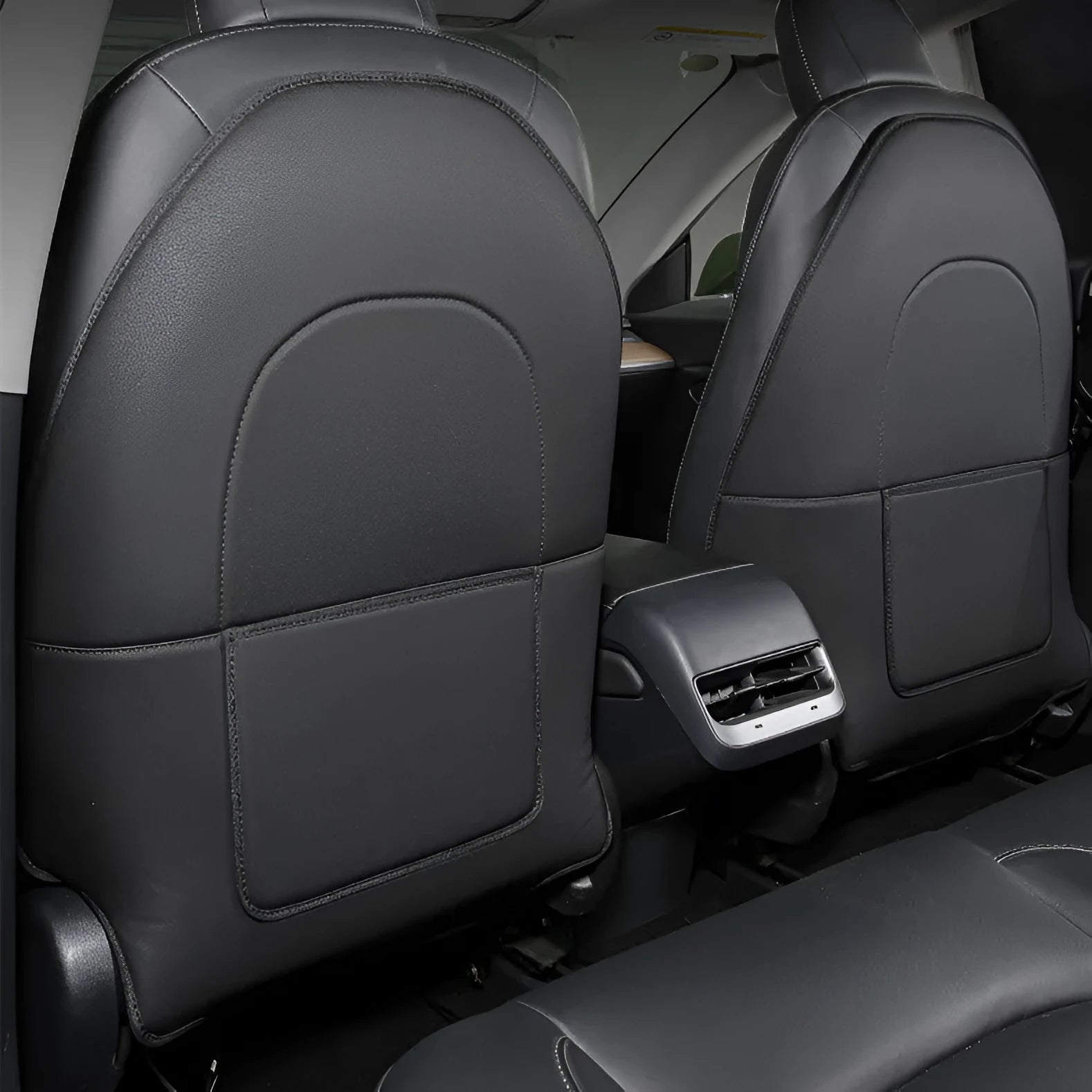 Black leather car seat anti kick pad with pocket measuring 68cm by 42cm